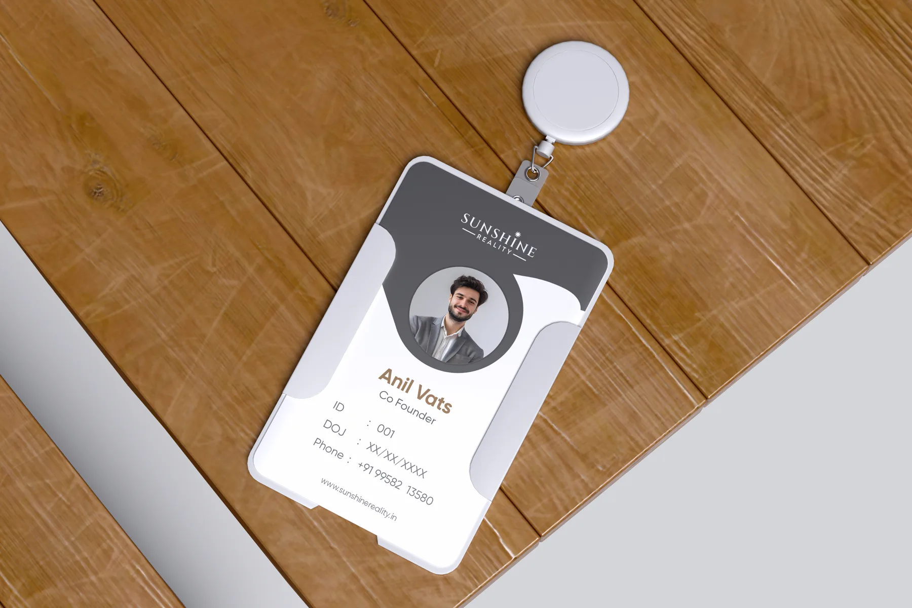Click to view full size Sunshine Reality staff ID card on a wooden desk